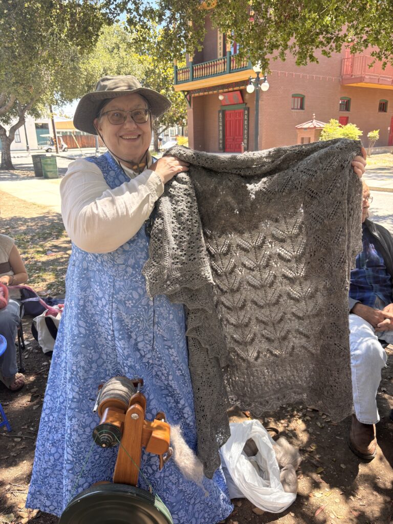 Ginger holding up her lace shawl